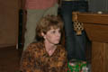 Mom watching someone open a present (50mm, f/4.0, 1/60 sec, External flash) <!--CRW_1827.CRW-->