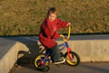 Mark riding his bike in the park (50mm, f/2.8, 1/1600 sec) <!--106_0685.CRW-->
