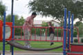 David and Mark playing on the jungle gym, bouncing (50mm, f/8.0, 1/60 sec)<!--CRW_1833.CRW-->