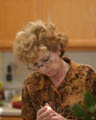 Mom cutting deviled eggs [cropped] (50mm, f/1.4, 1/50 sec, External flash) <!--CRW_1819.CRW-->