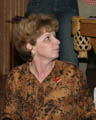 Mom watching someone else open a Christmas present [cropped] (50mm, f/4.0, 1/60 sec, External flash) <!--CRW_1831.CRW-->
