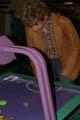 Mom playing air hockey [Chuck E. Cheese] (50mm, f/4.0, 1/60 sec, built-in flash)
