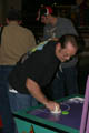 Paul playing air hockey [Chuck E. Cheese] (50mm, f/4.0, 1/60 sec, built-in flash)
